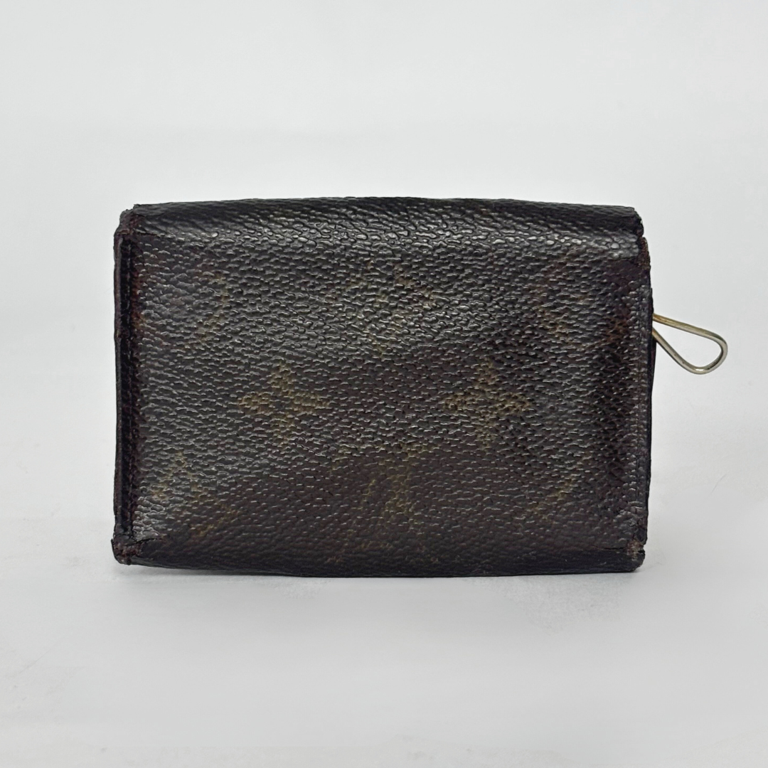 Black leather wallet on a light gray background
