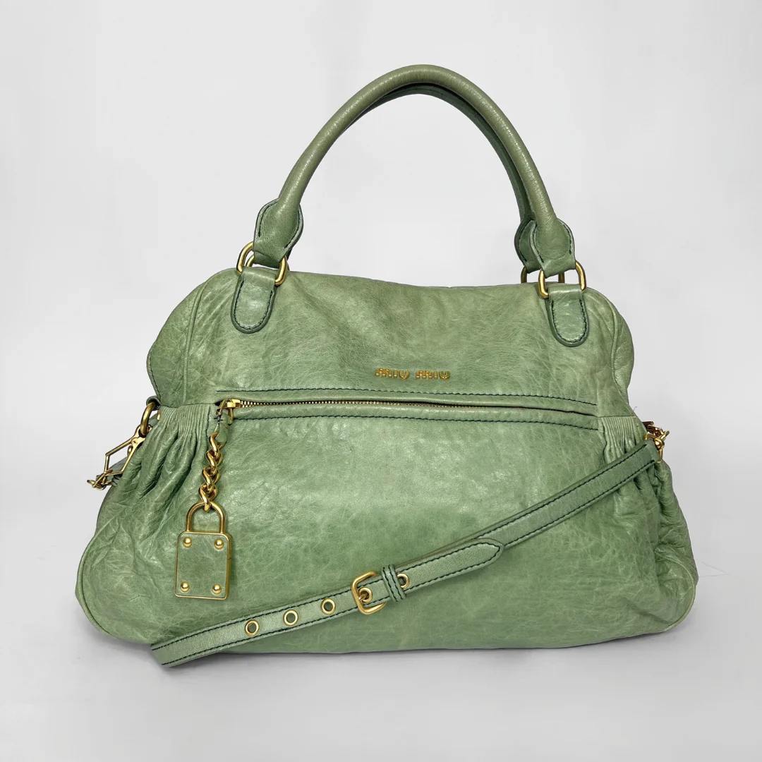 Green Miu Miu handbag with gold accents 