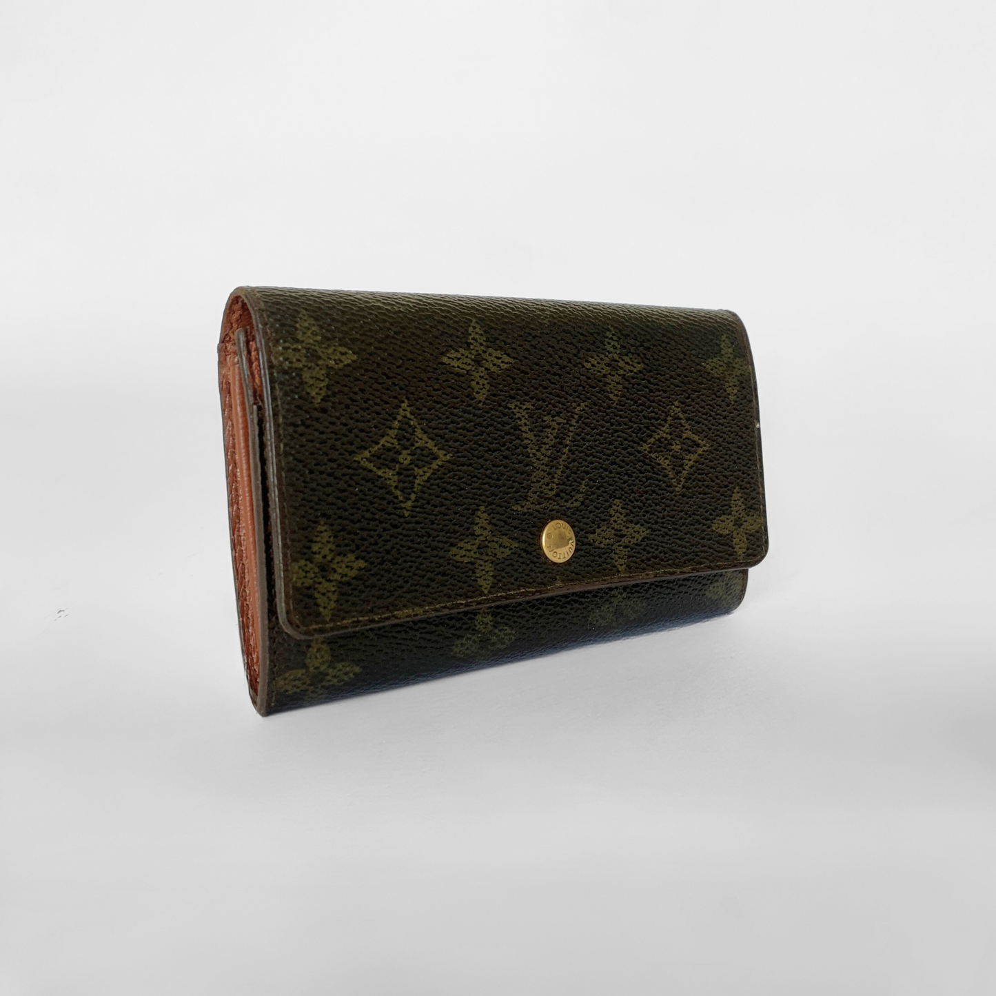 Black leather wallet with a gold button on a white background