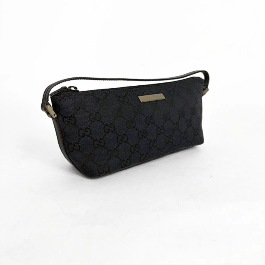 Black patterned handbag on a white background