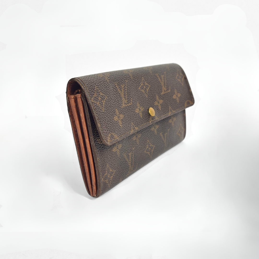 Brown LV wallet with gold monogram pattern on a white background