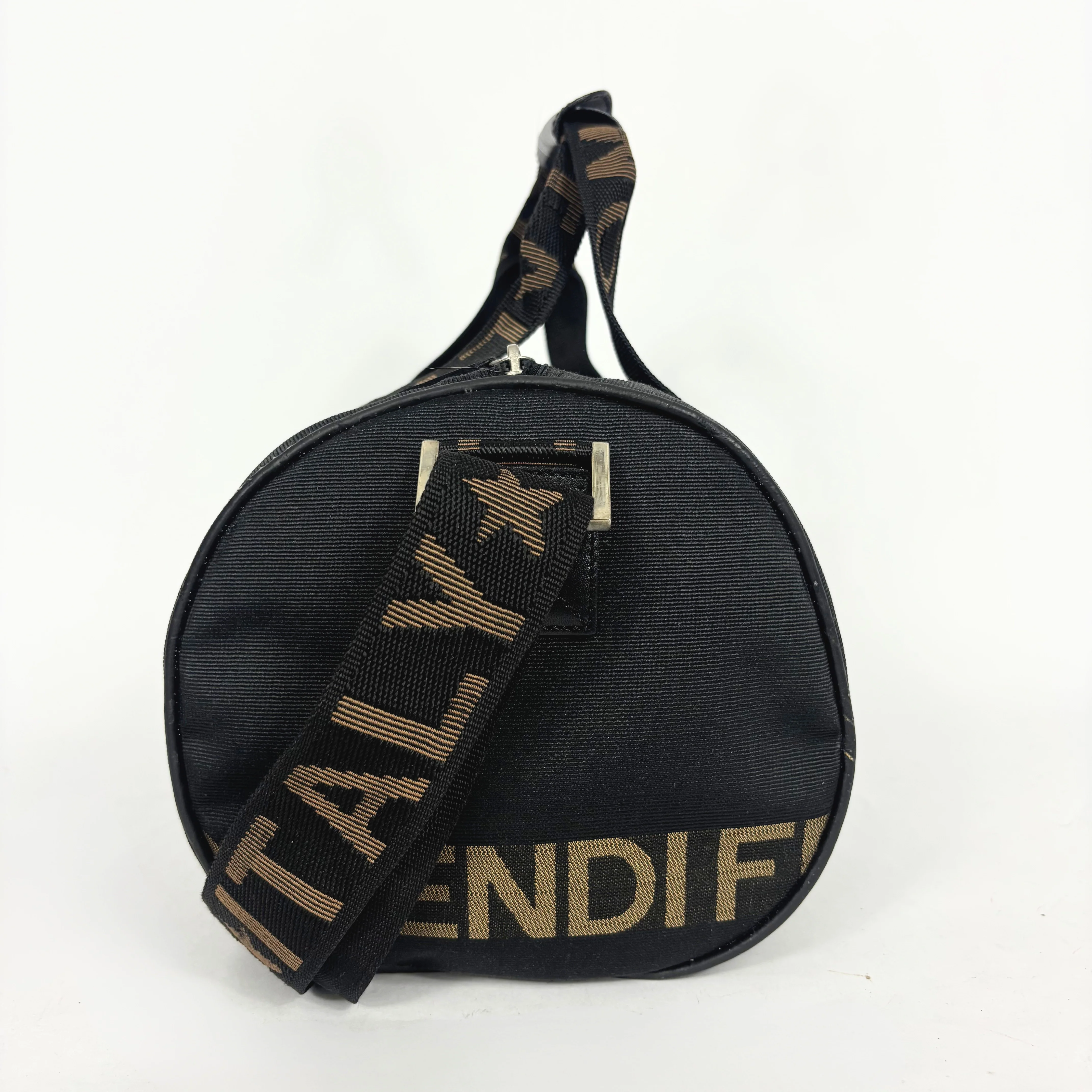 Black duffel bag with 'FENDI' logo on a white background