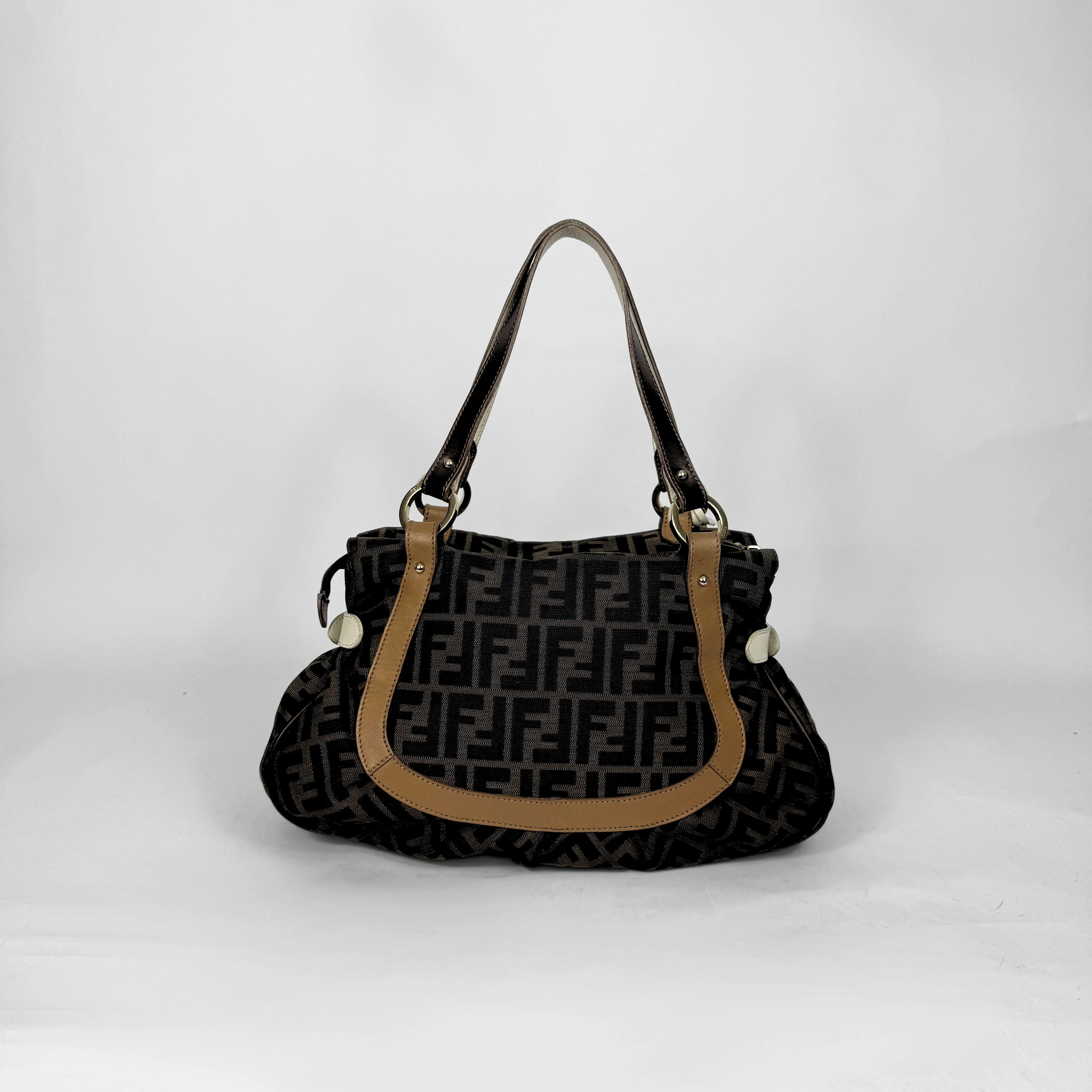 Fendi Zucca monogram canvas shoulder bag with letaher trim and a large white cicular FENDI charm.
