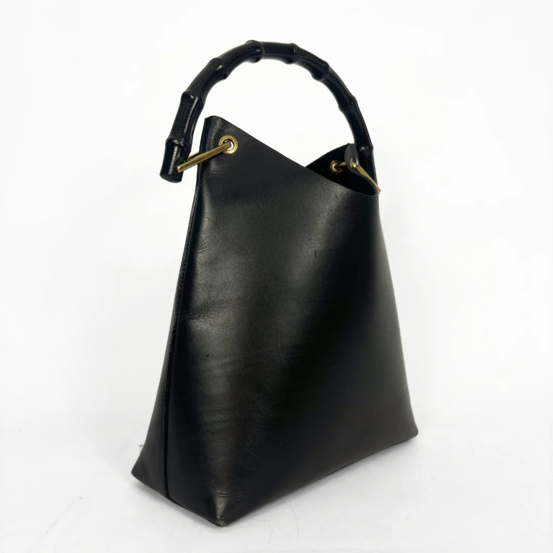 Gucci vintage black leather hobo hag with a dark wood bamboo top handle and gold-tone hardware.