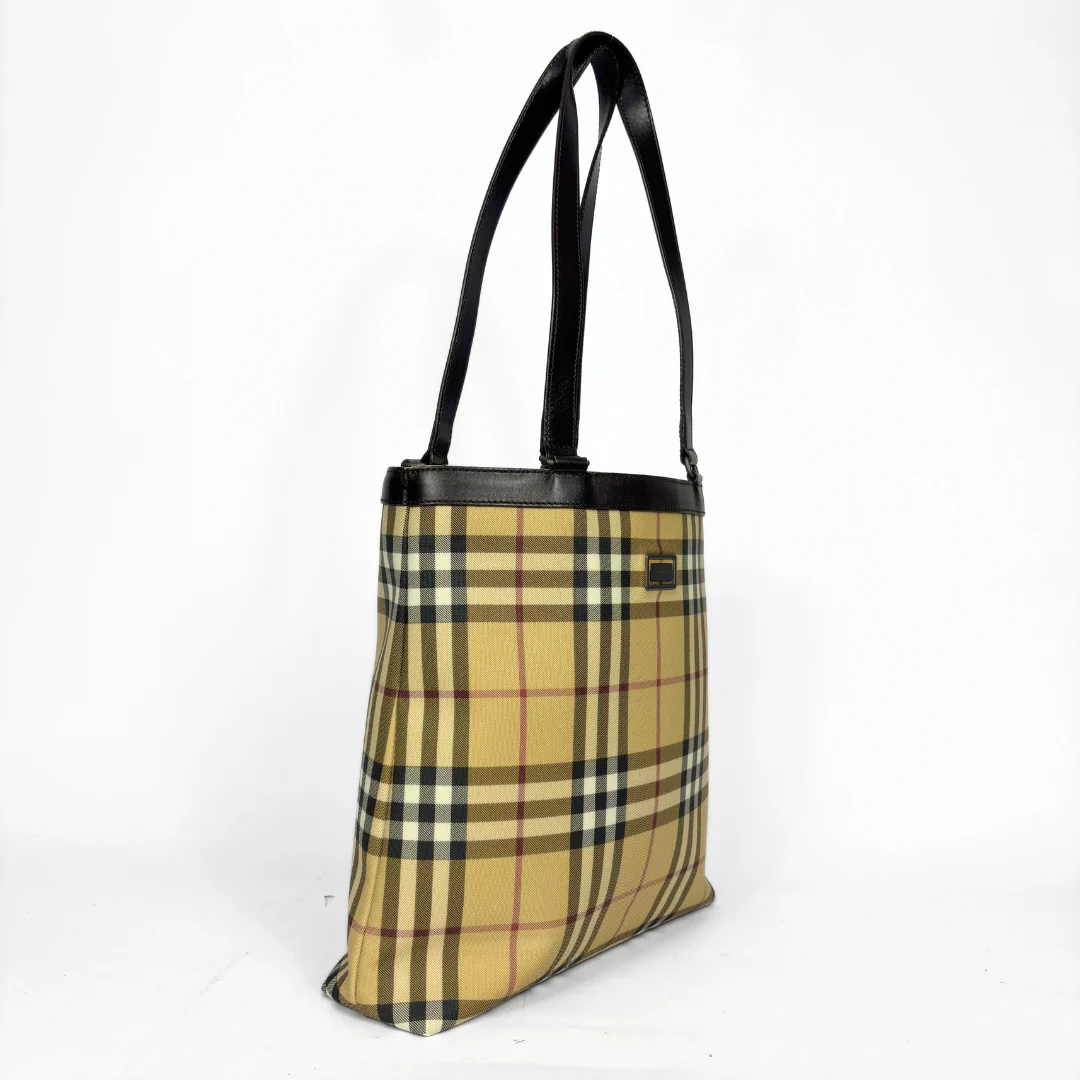 Beige checkered tote bag with black handle on a white background