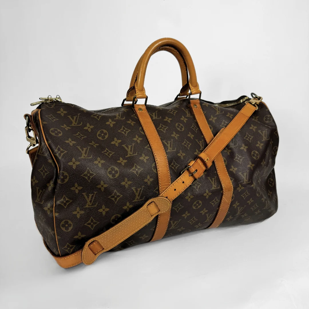 Louis Vuitton Keepall 50 with strap on a white background 