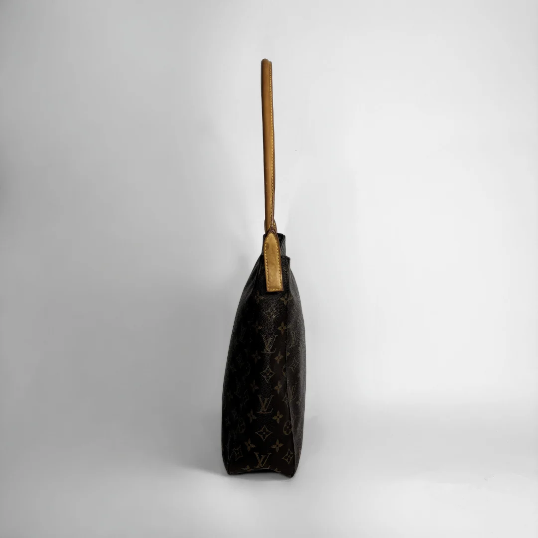 Louis Vuitton dark brown monogram canvas shoulder bag with a light brown leather handle, shown from a side profile view against a light gray background.