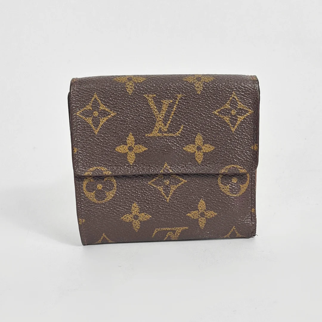 Louis Vuitton wallet with monogram pattern on a white background