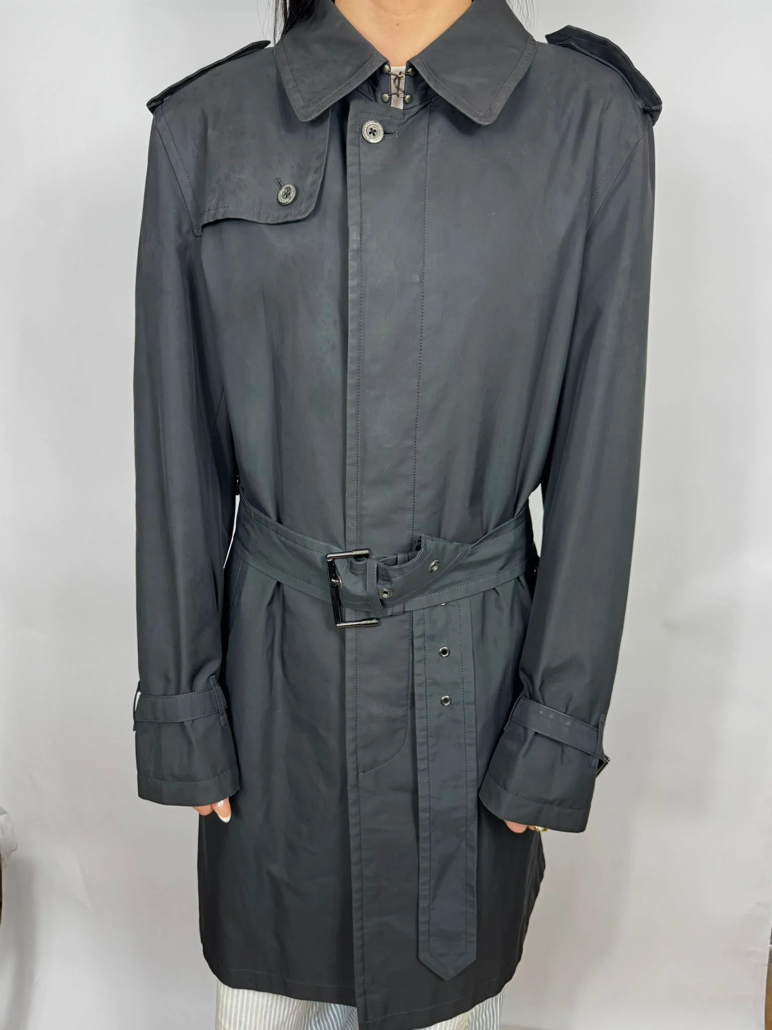 Dark gray trench coat on a white background