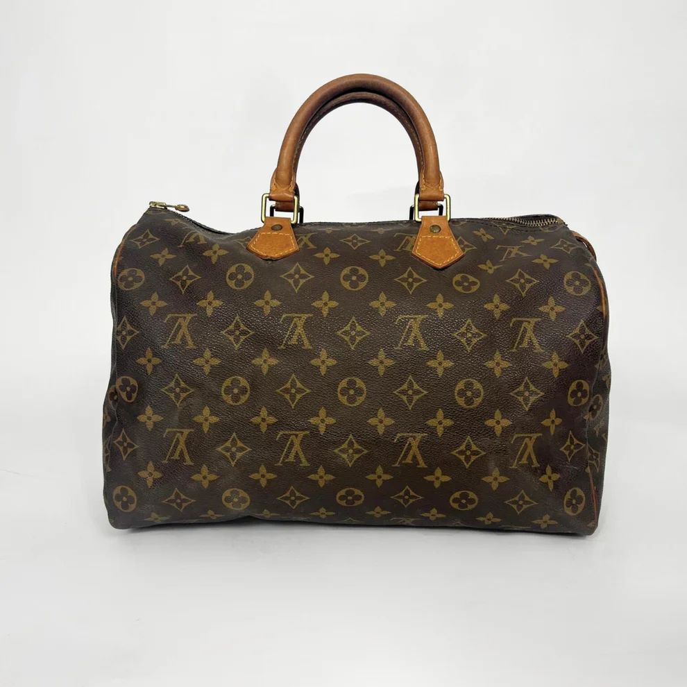 Brown patterned handbag on a white background