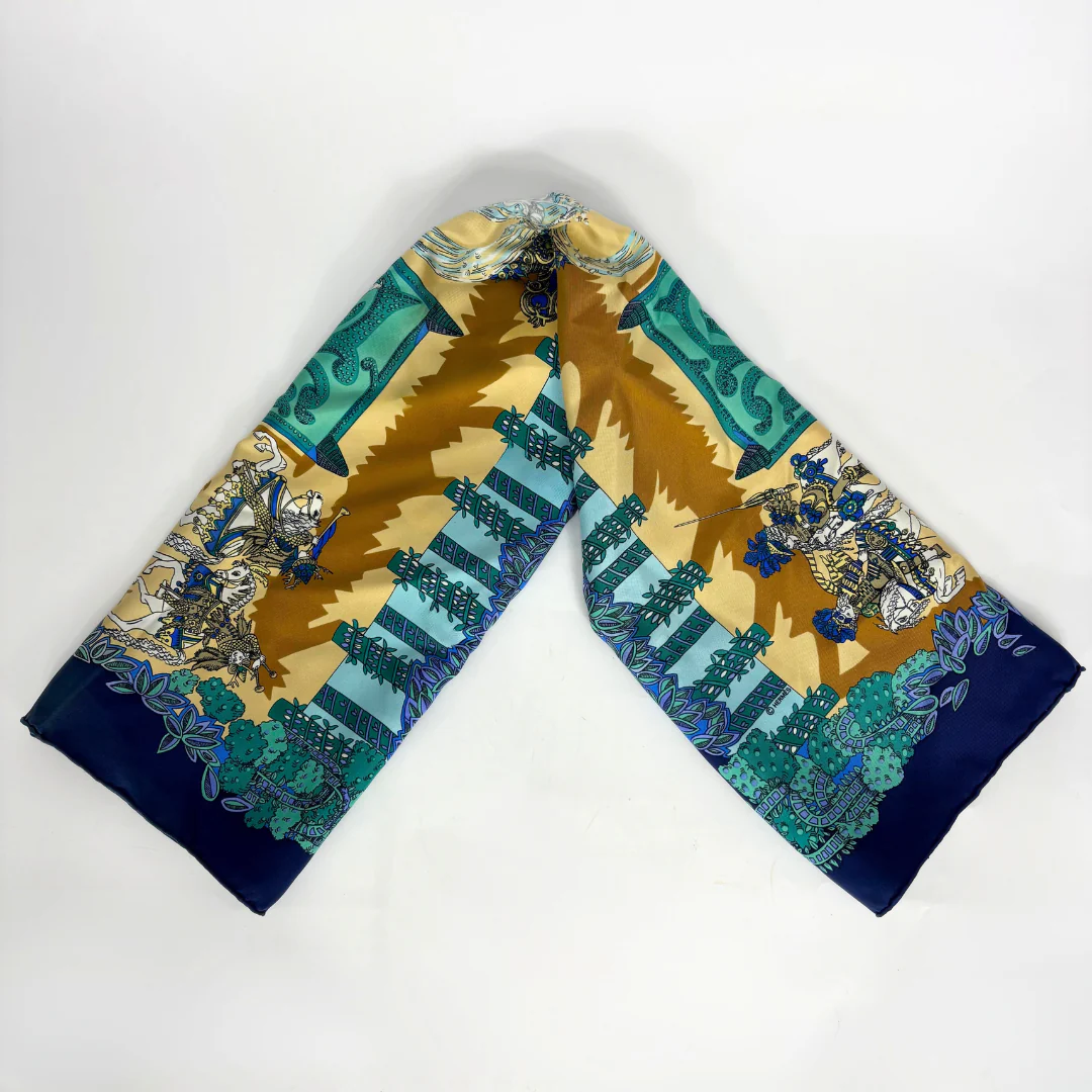 Decorative scarf with intricate patterns on a white background