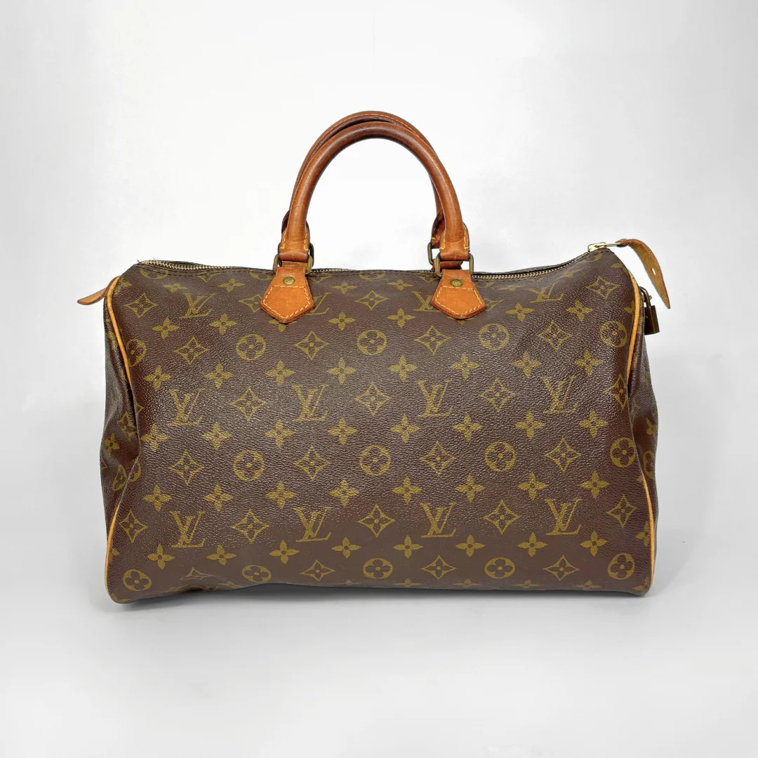 Brown Louis Vuitton handbag with monogram pattern on a white background