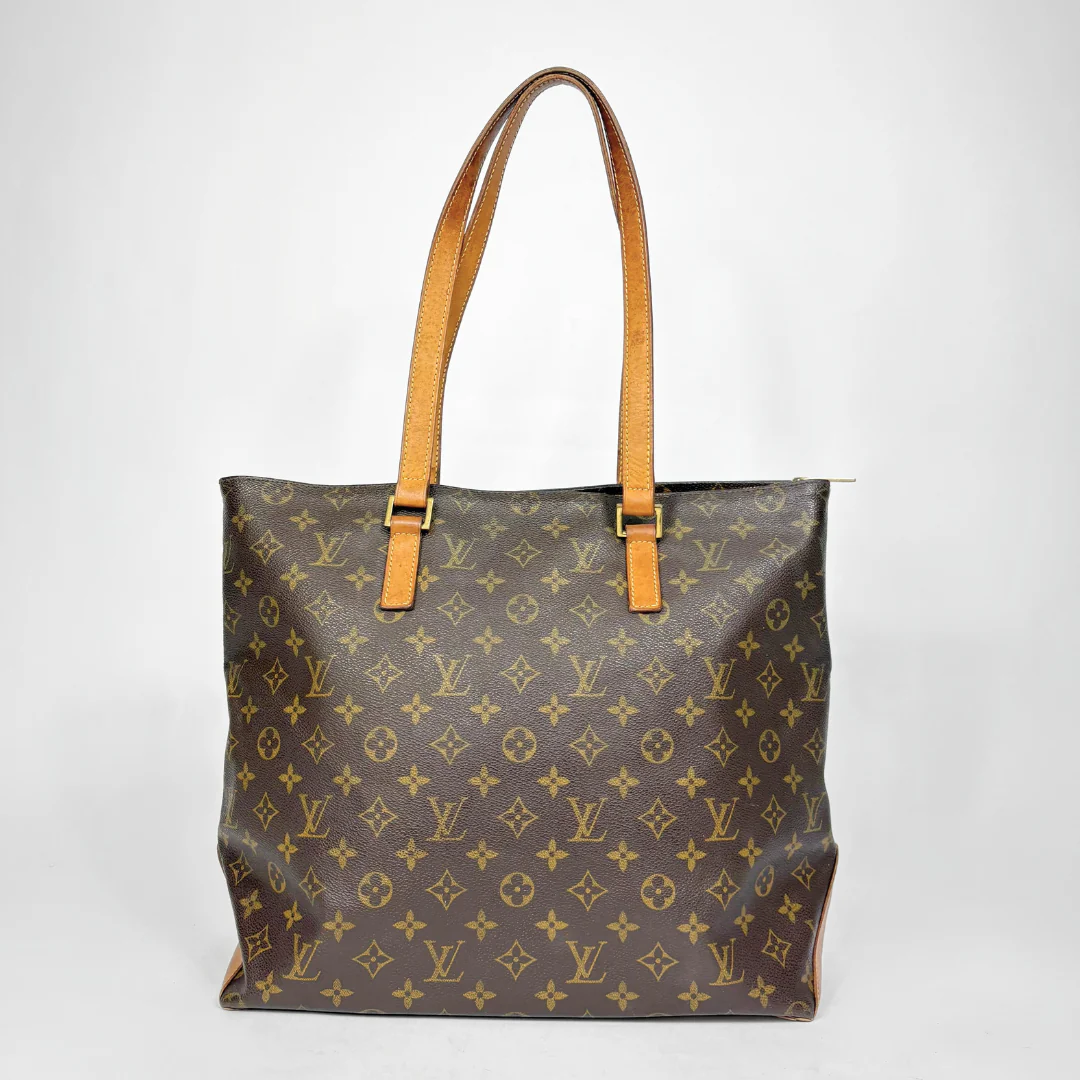 Designer handbag with monogram pattern on a white background