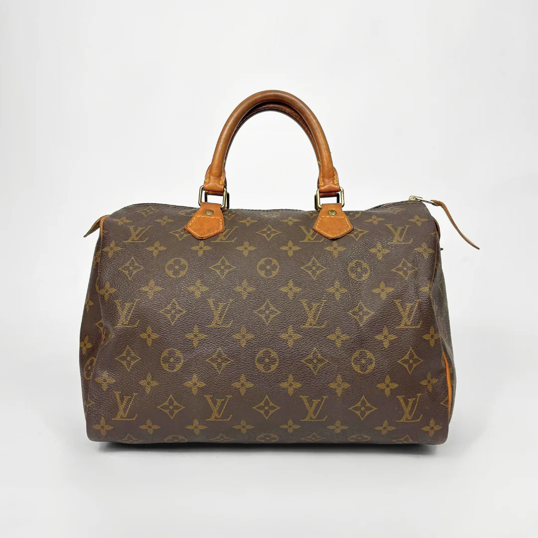 Brown Louis Vuitton handbag with monogram pattern on a white background