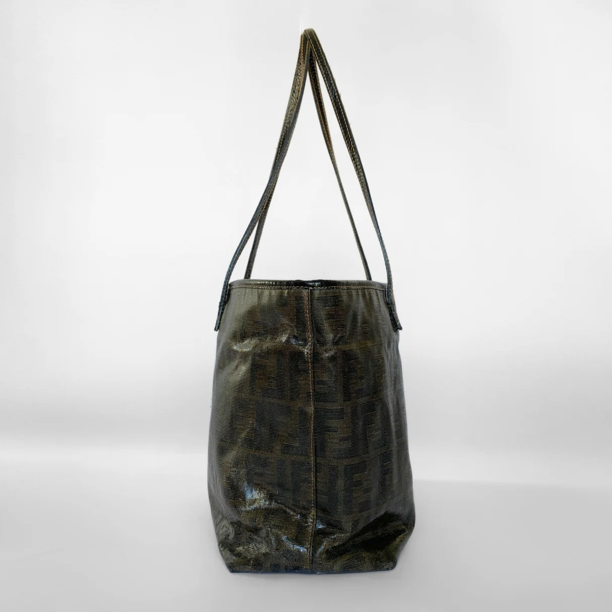 Black textured handbag with a shoulder strap on a white background