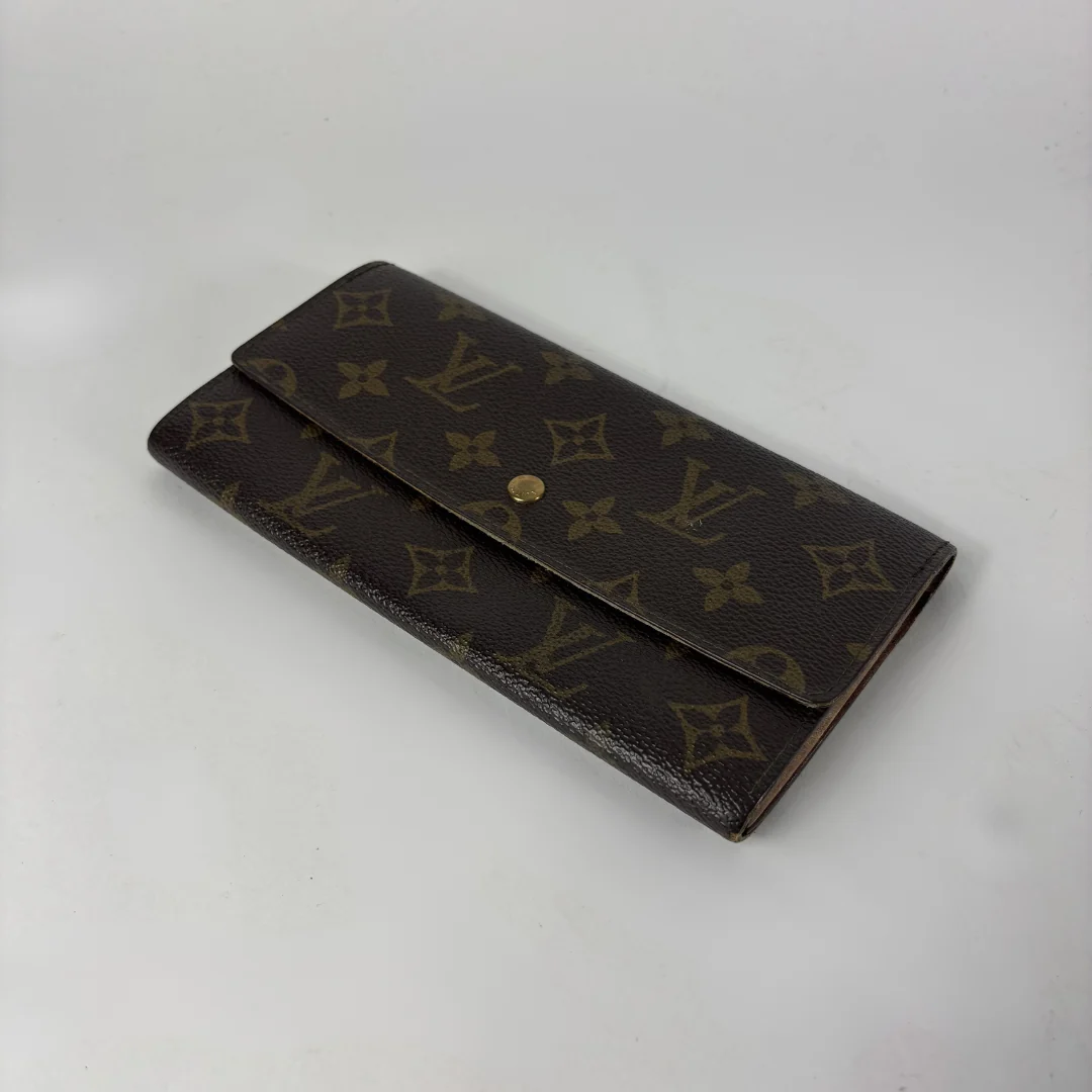 Louis Vuitton wallet on white background