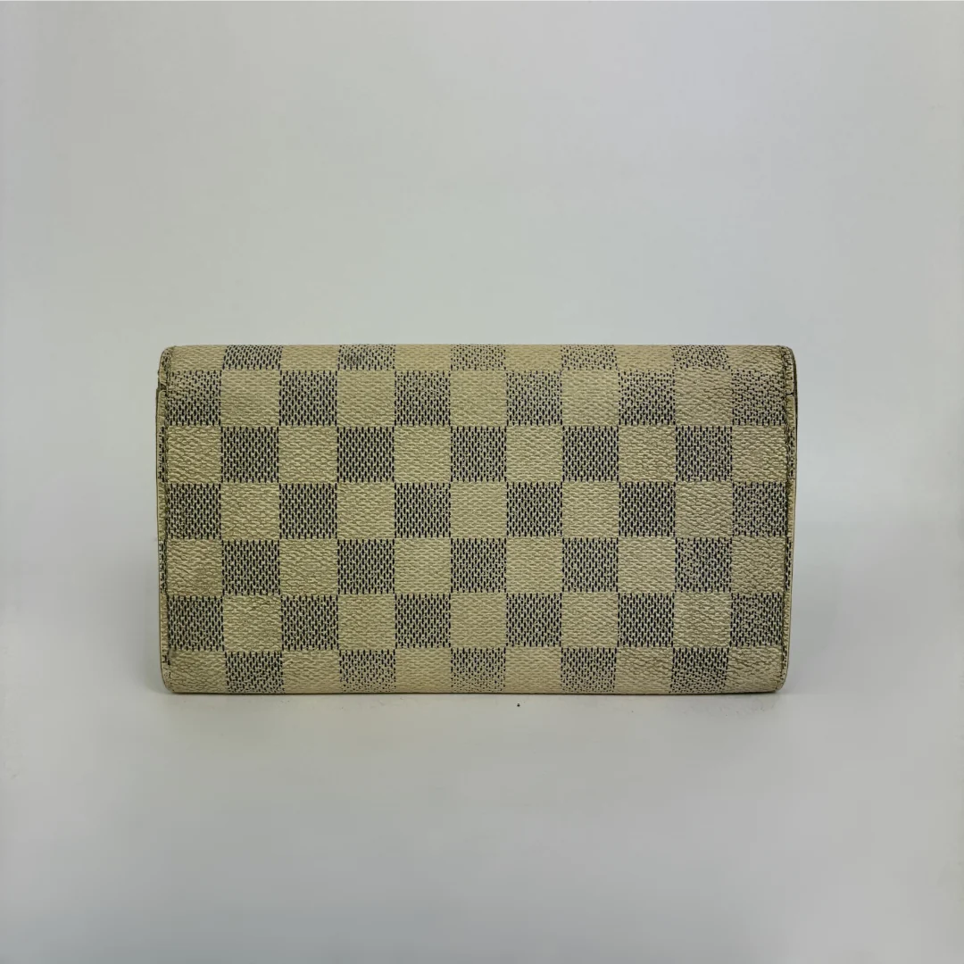 Louis Vuitton wallet on white background