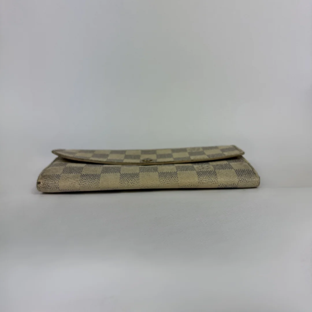 Louis Vuitton wallet on white background