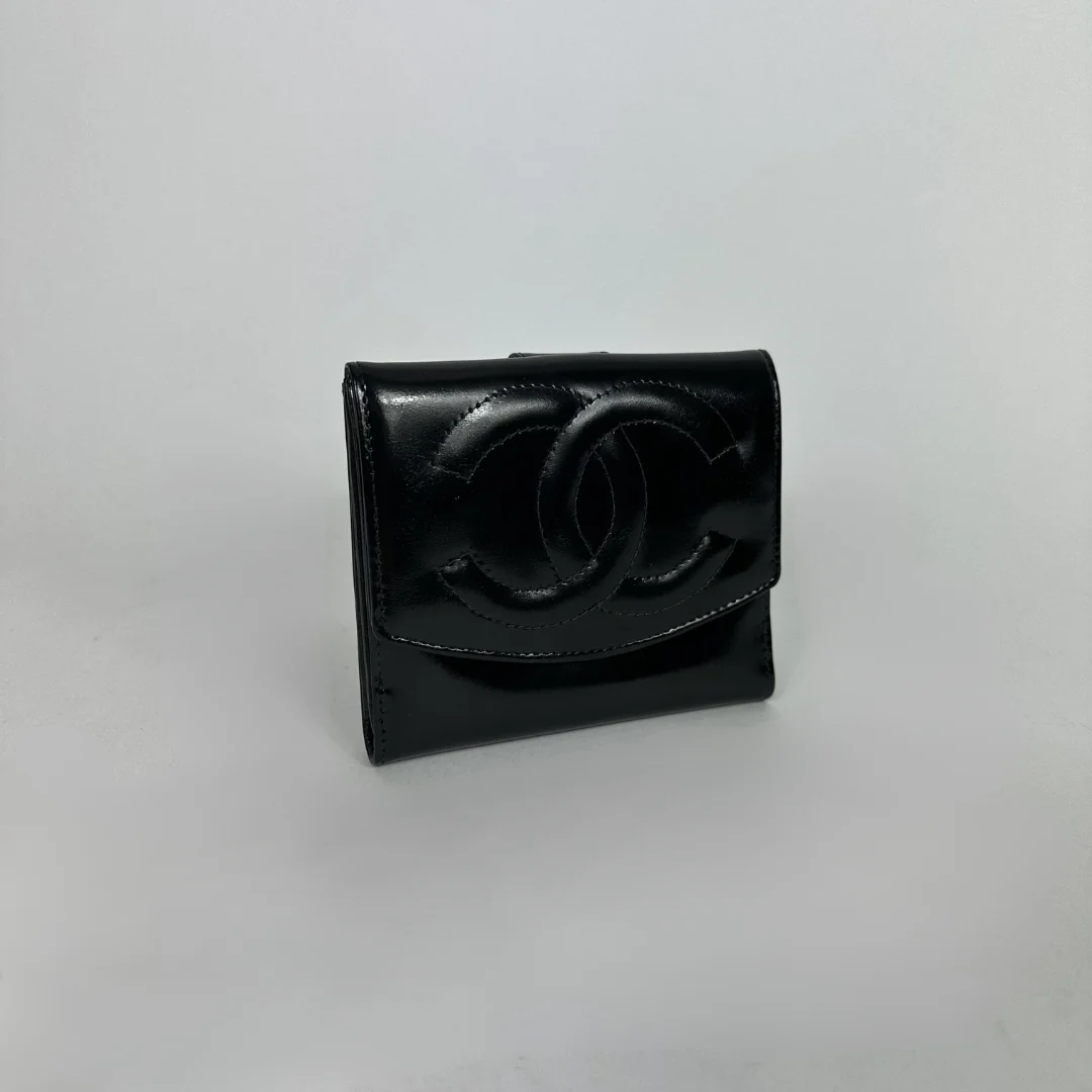 Black Chanel wallet on white background