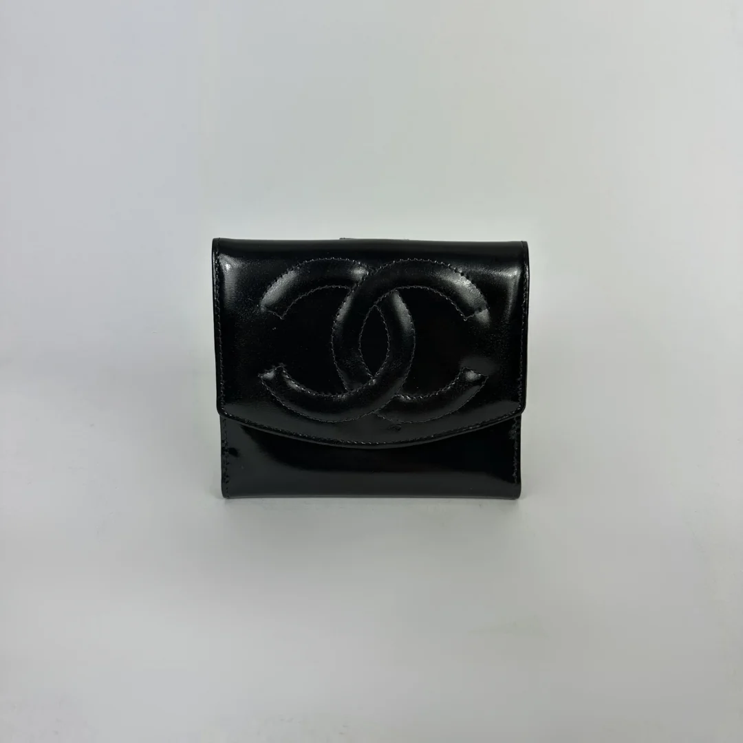 Black Chanel wallet on white background