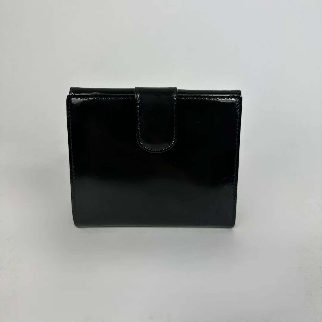 Black Chanel wallet on white background