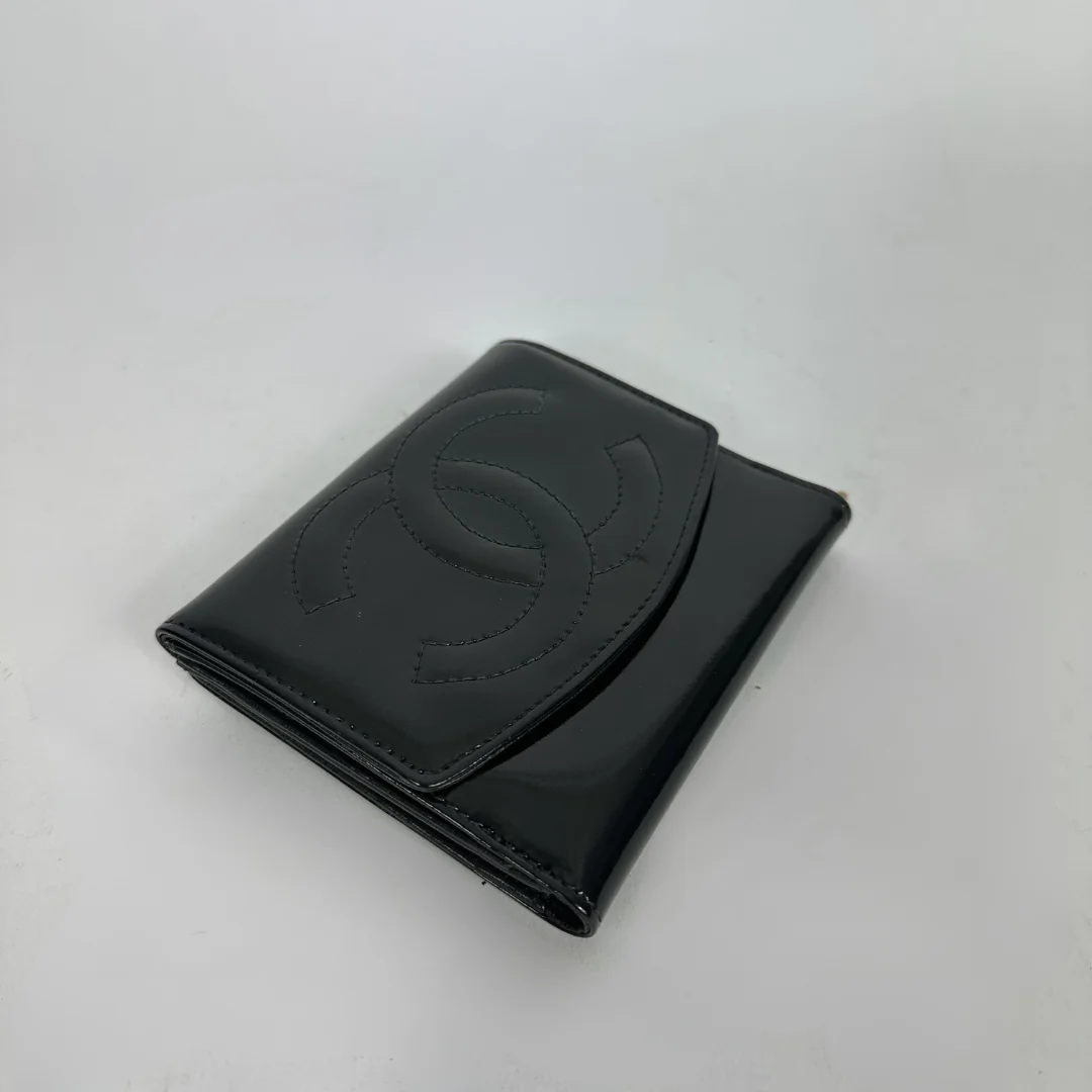 Black Chanel wallet on white background