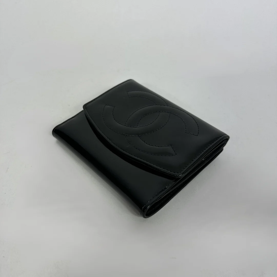 Black Chanel wallet on white background