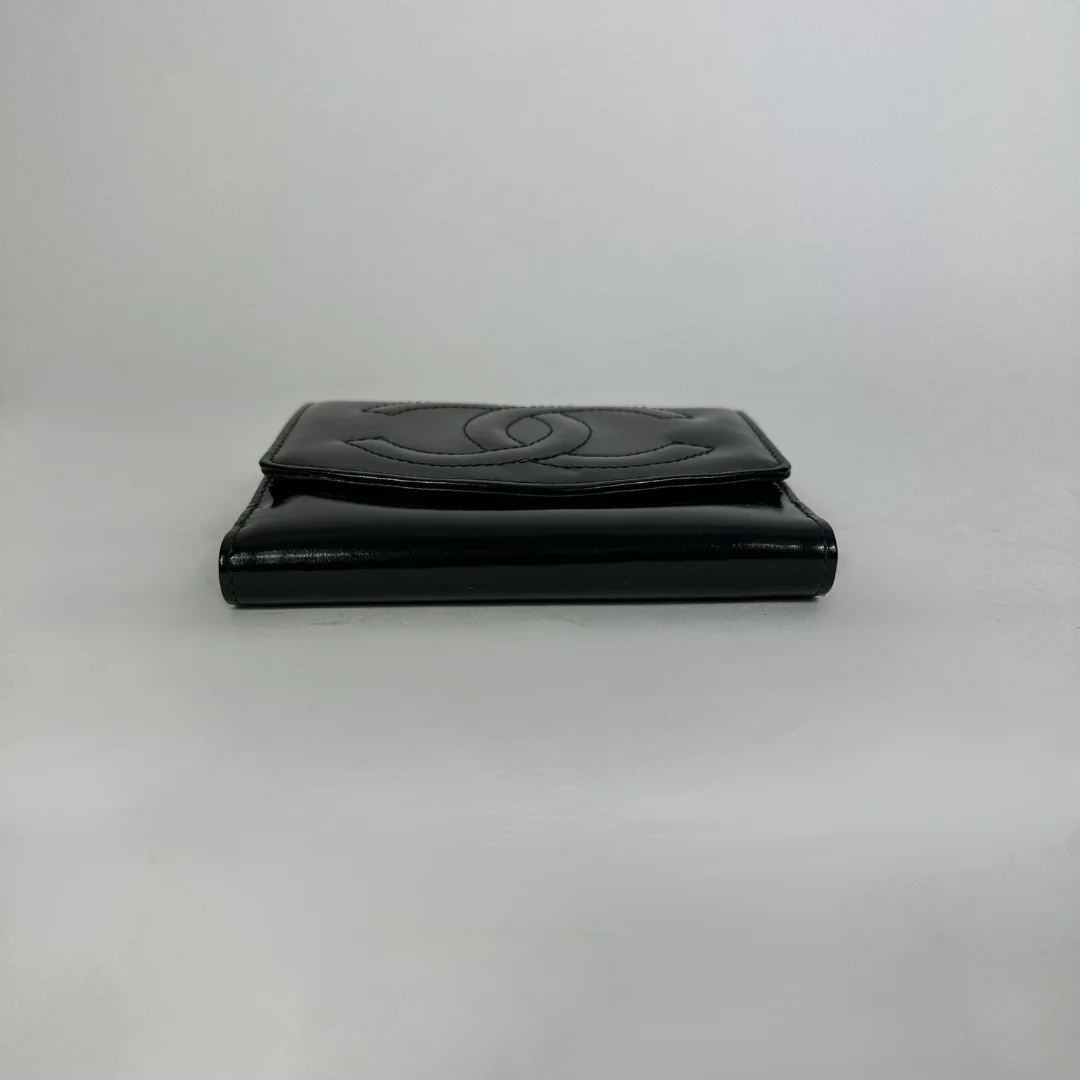 Black Chanel wallet on white background