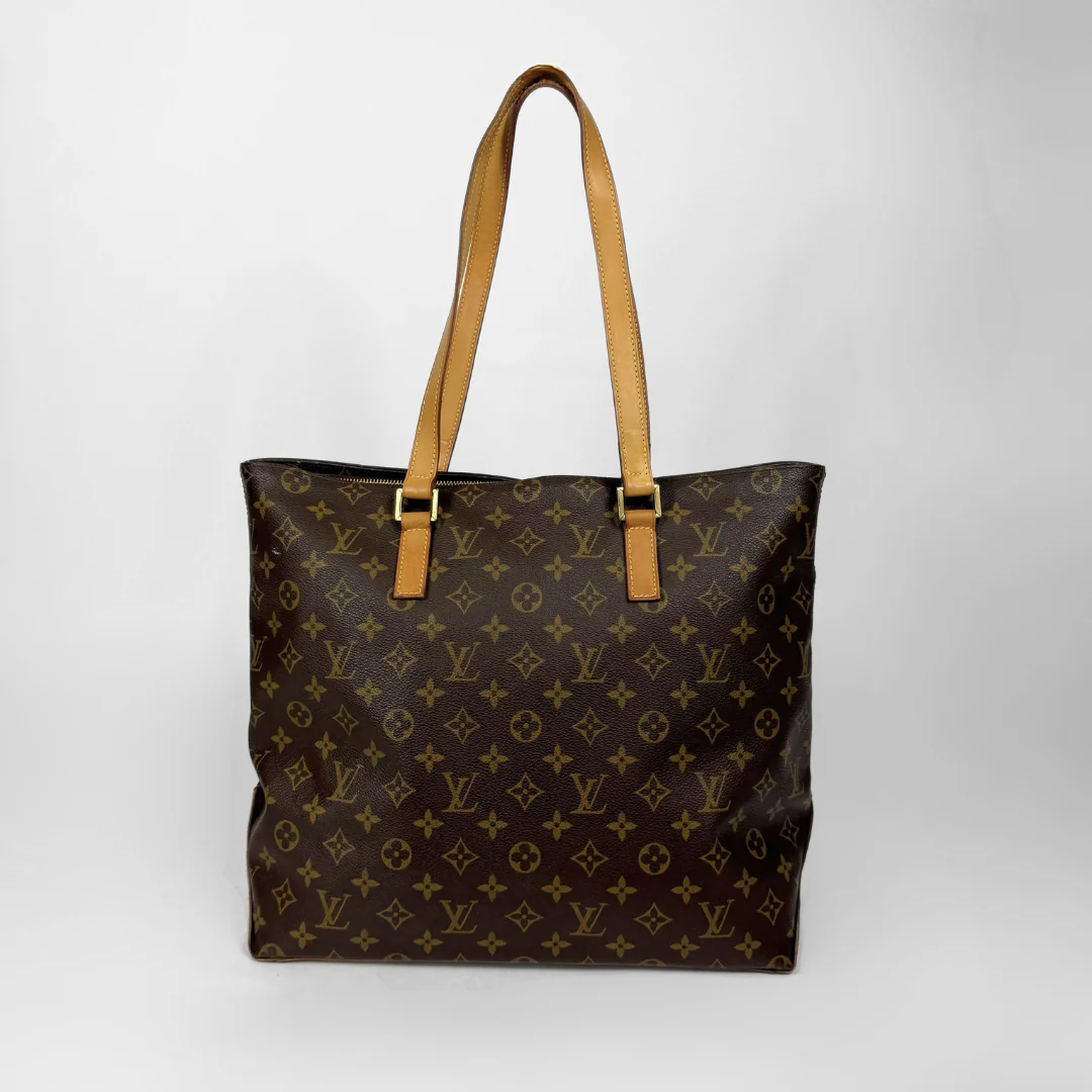 Designer handbag with monogram pattern on a white background