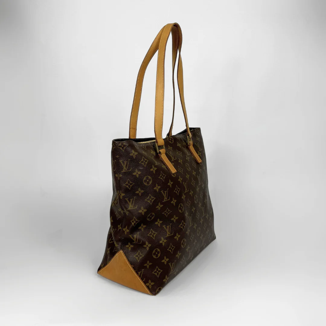 Designer handbag with monogram pattern on a white background
