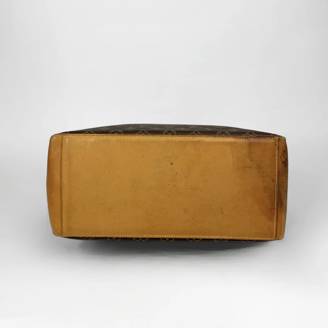 Brown leather ottoman on a white background
