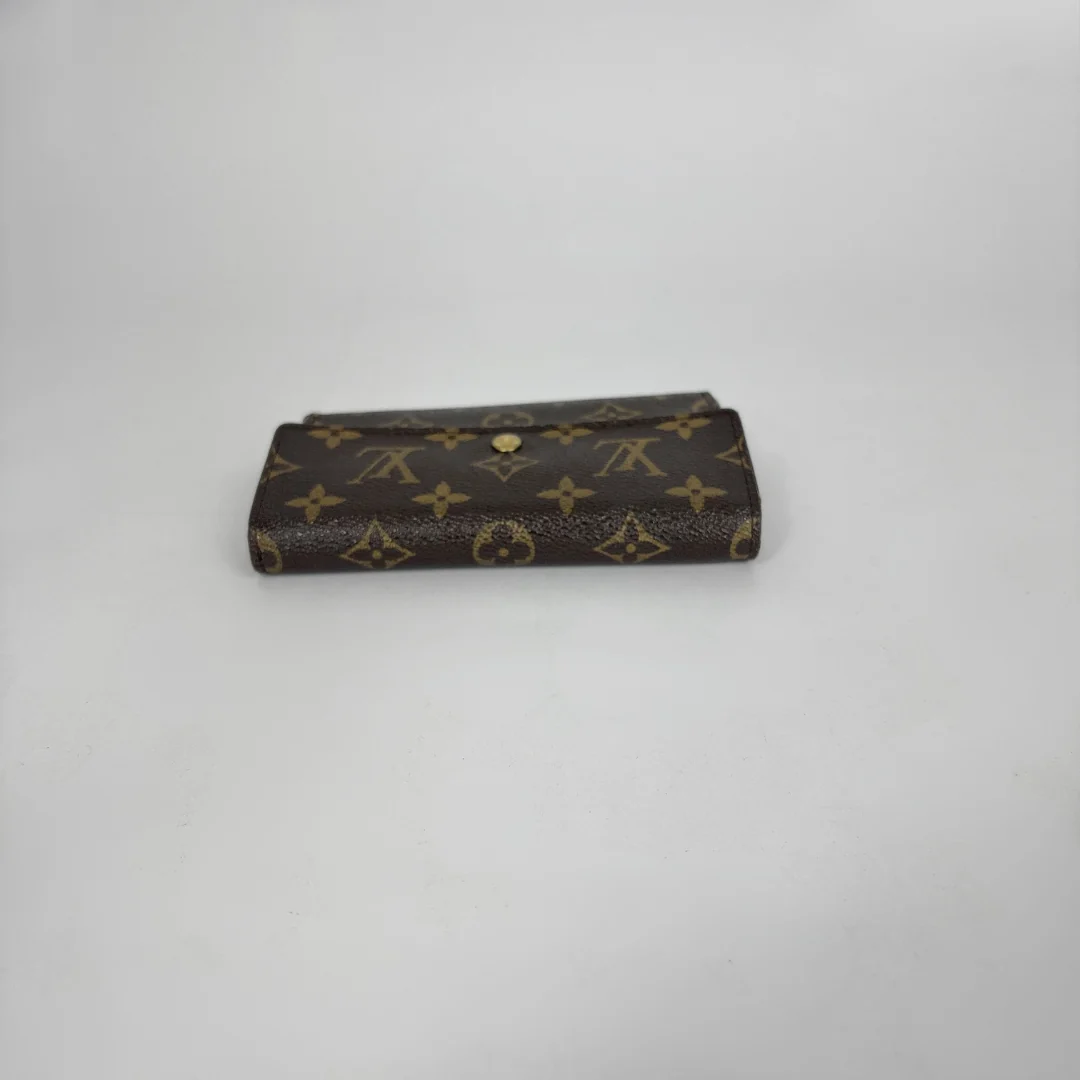 Louis Vuitton Wallet International on a white background
