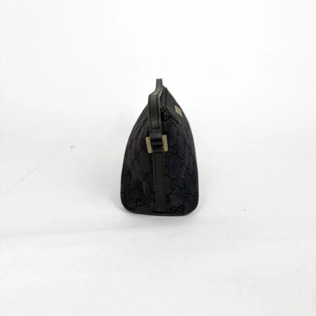 Black textured pouch with a gold buckle on a white background