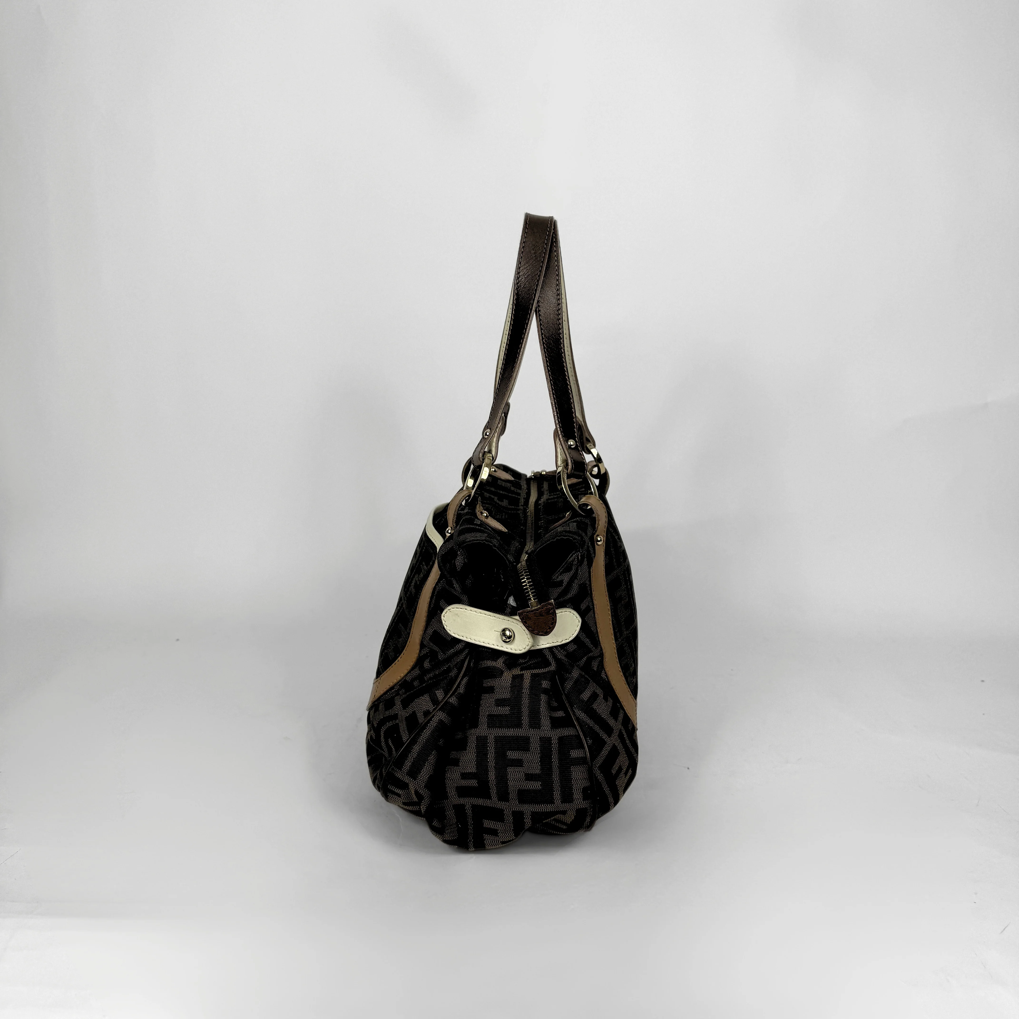 Fendi Zucca monogram canvas shoulder bag with letaher trim and a large white cicular FENDI charm.