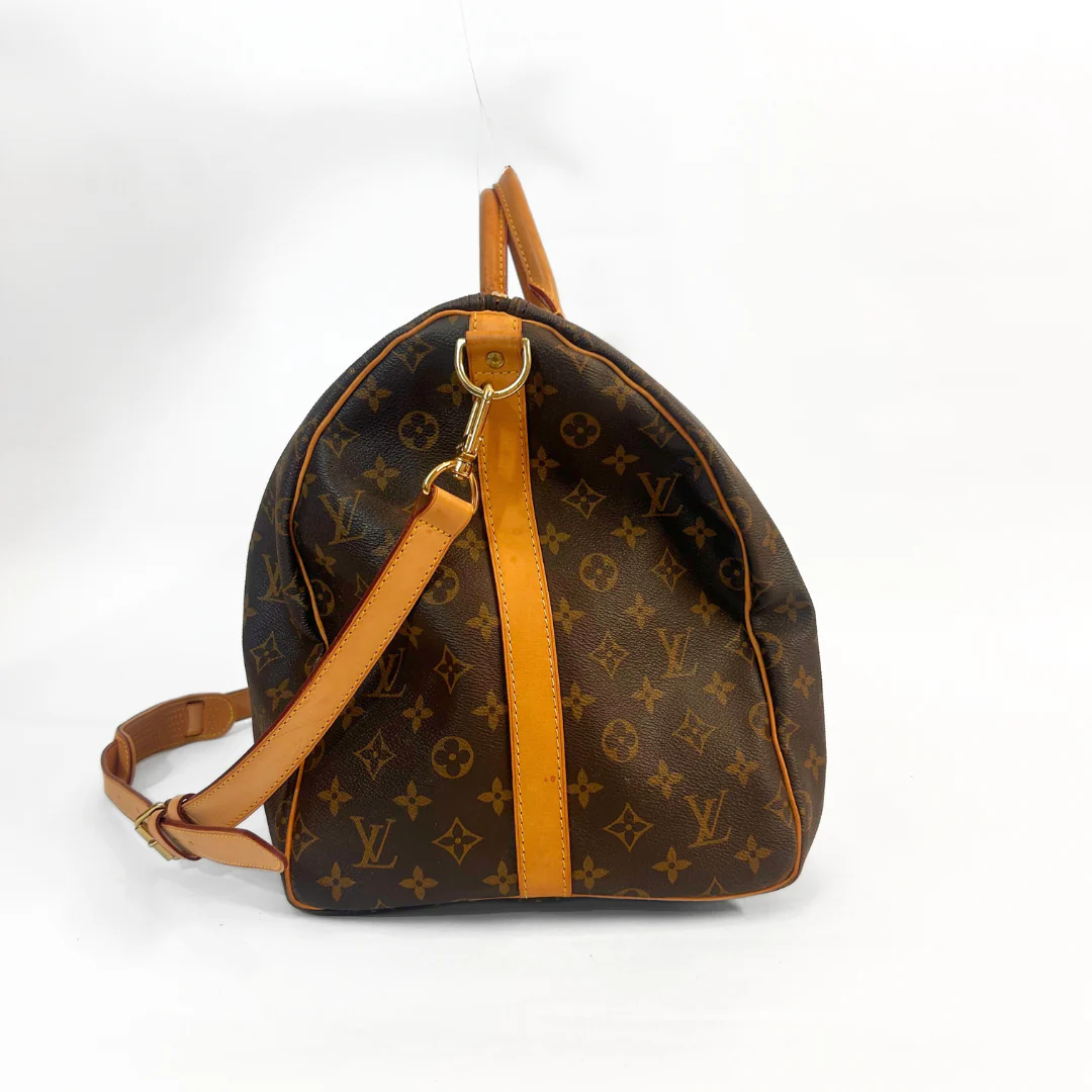 Designer backpack with monogram pattern on a white background