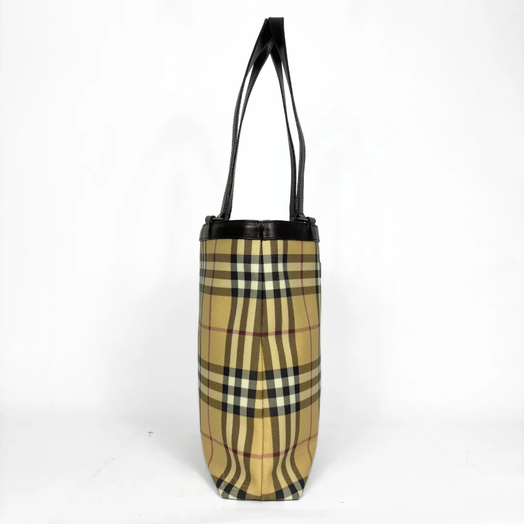 Beige checkered tote bag with black handle on a white background