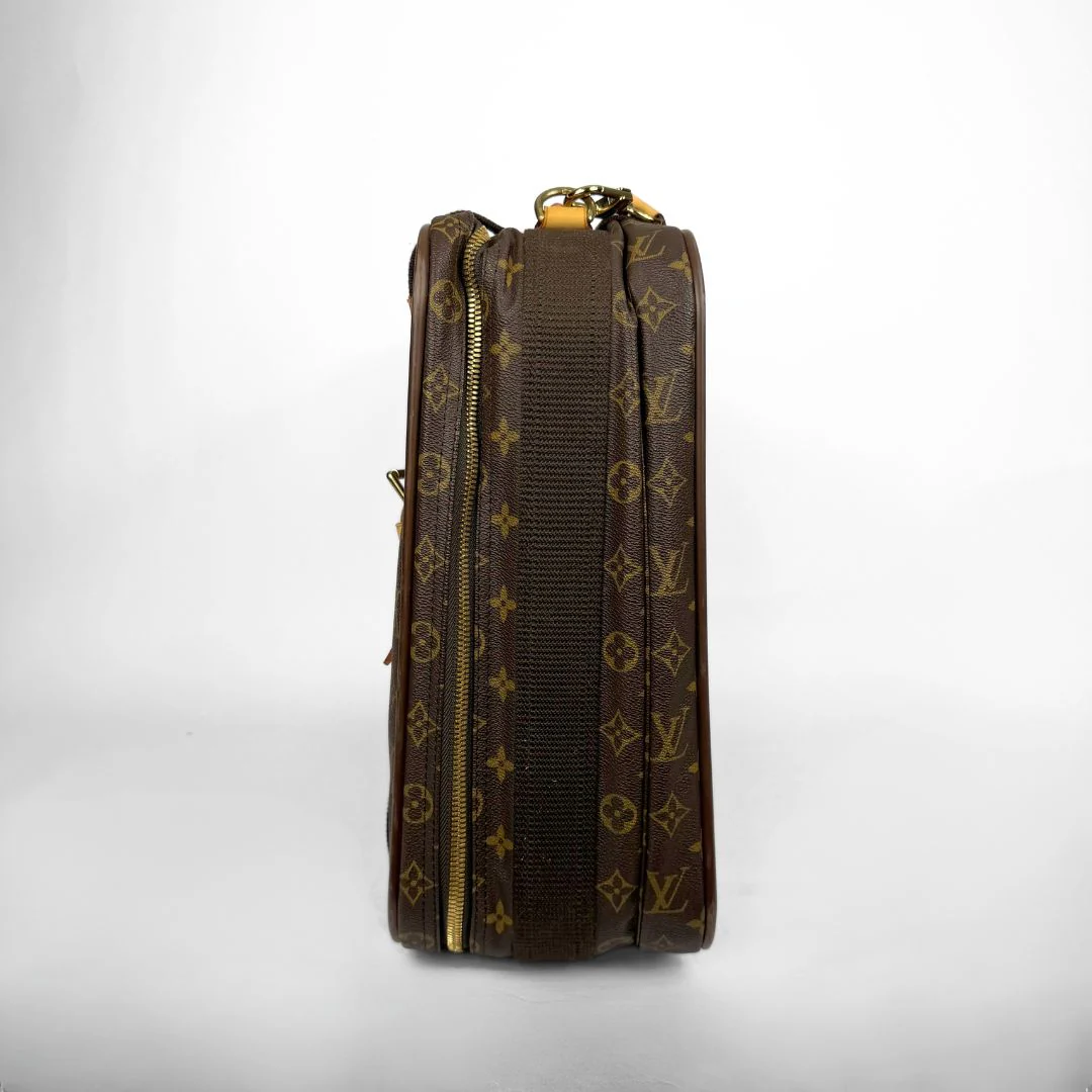 Brown leather bag with gold monogram pattern on a white background