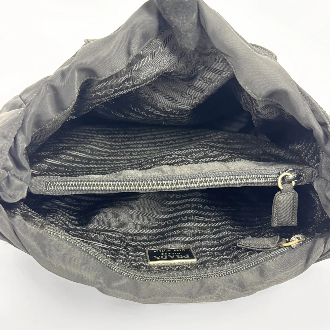 Prada black nylon tote bag with top handles and the classic enamel triangle logo: INSIDE
