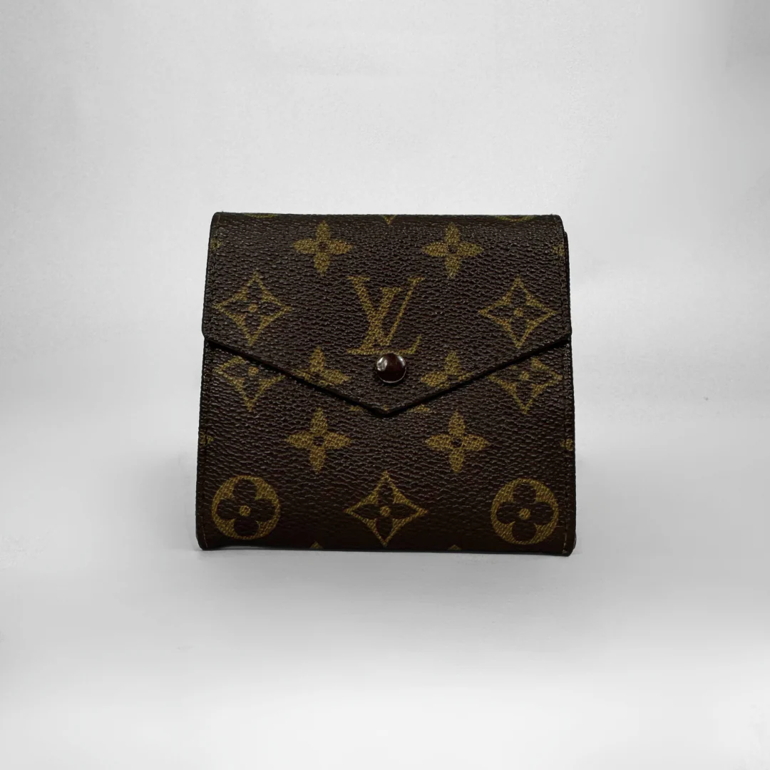 Louis Vuitton wallet with monogram pattern on a white background