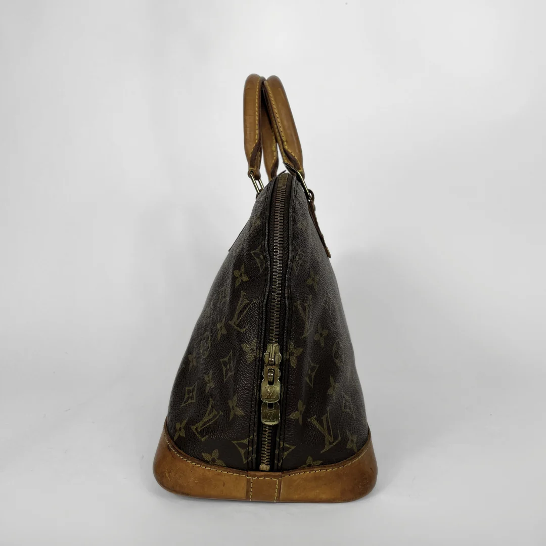 Louis Vuitton Alma Monogram Canvas on a white background