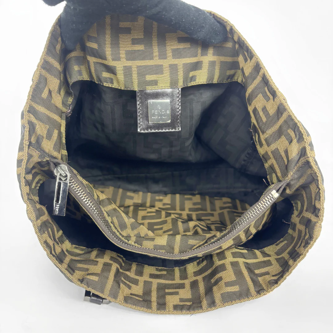 Fendi shopper bag in brown and black Zucca monogram canvas with black leather handles.