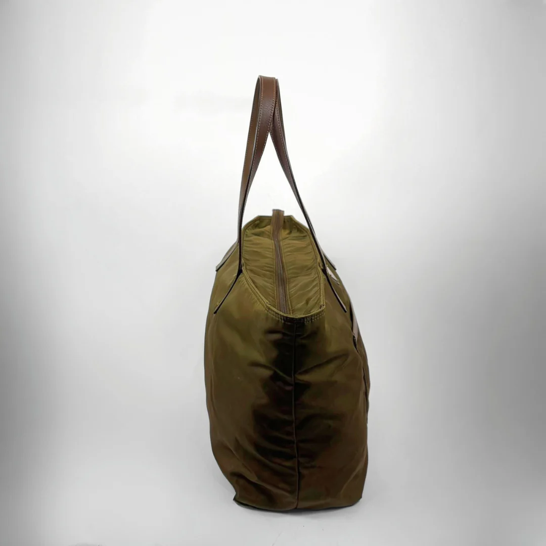 Green bag with brown handle on a white background