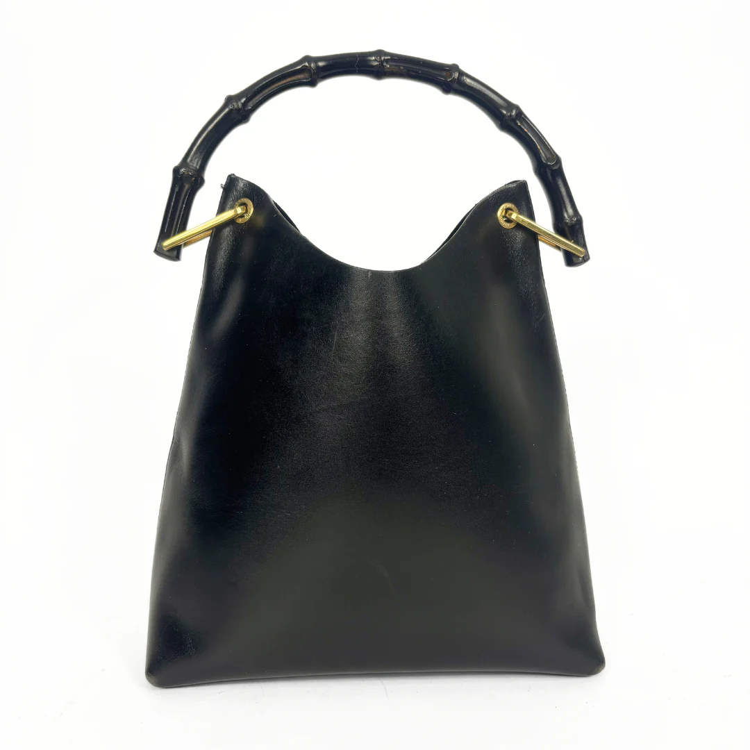 Gucci vintage black leather hobo hag with a dark wood bamboo top handle and gold-tone hardware.