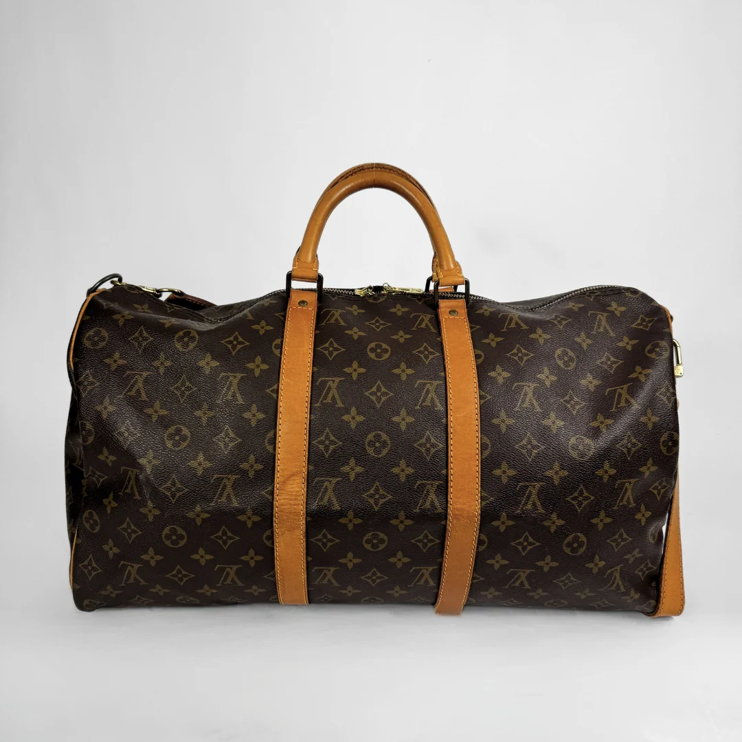 Louis Vuitton Keepall 50 with strap on a white background 