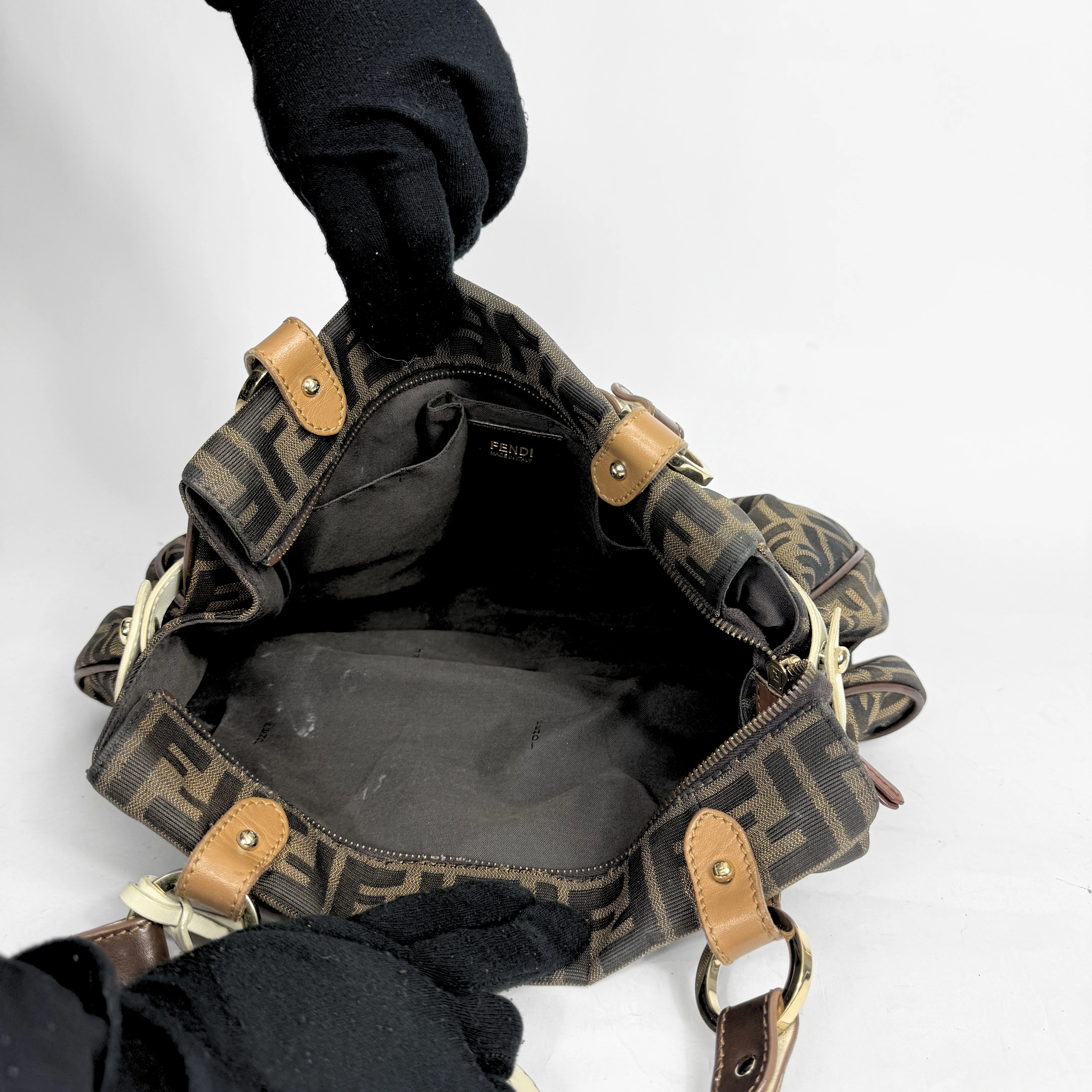 Fendi Zucca monogram canvas shoulder bag with letaher trim and a large white cicular FENDI charm: INSIDES.