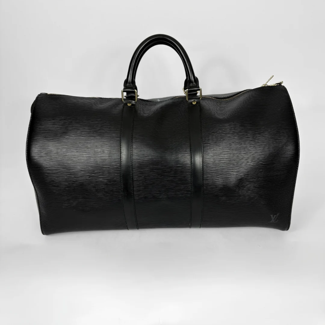 Black leather duffel bag on a white background