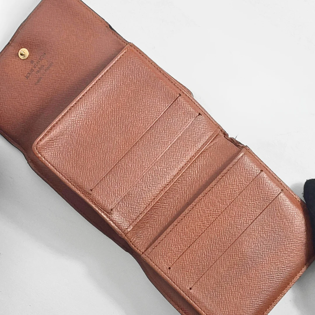 Brown leather wallet on a light gray background