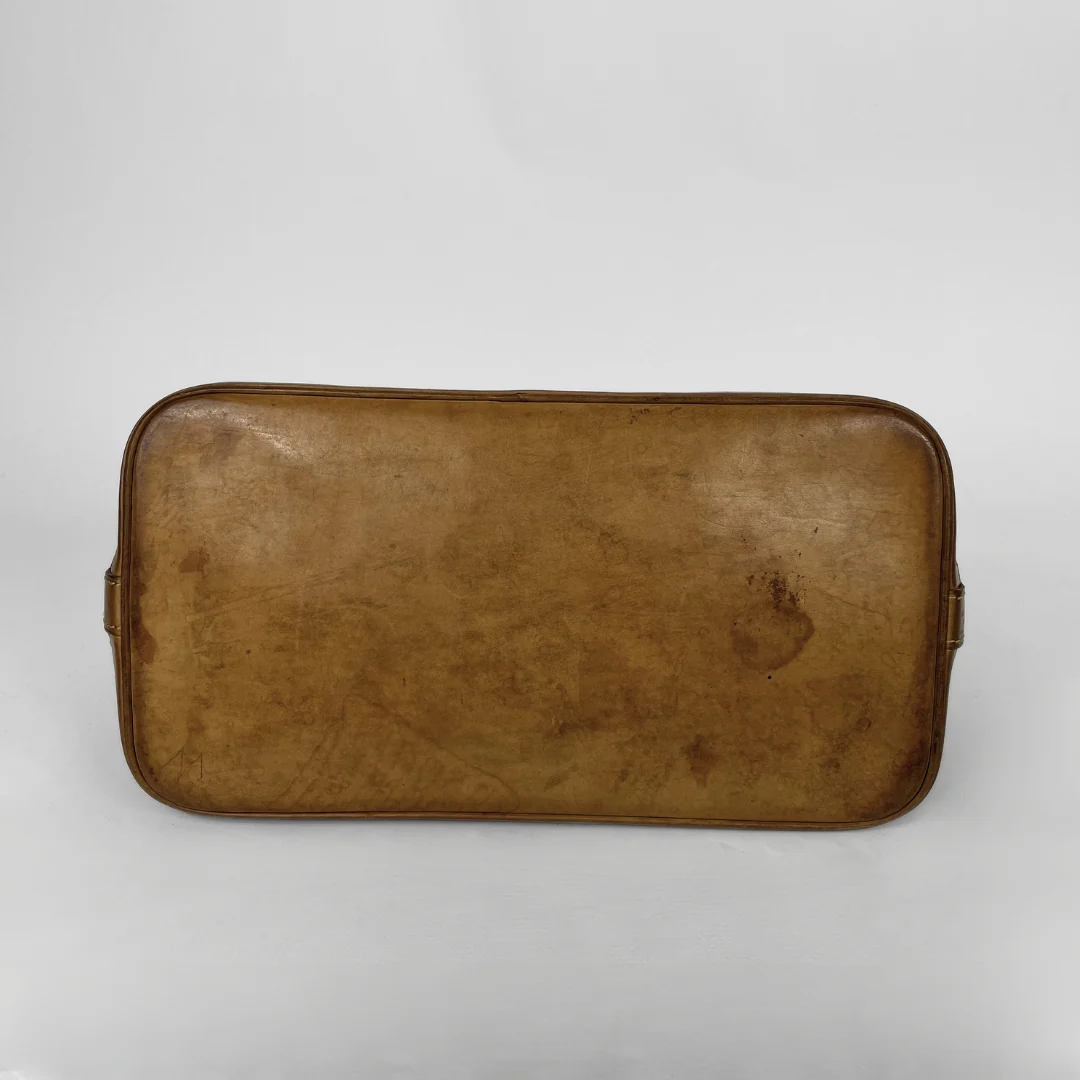 Louis Vuitton Alma Monogram Canvas on a white background
