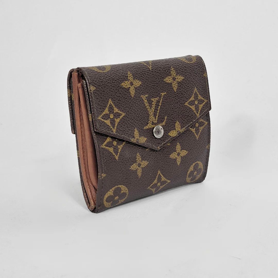 Louis Vuitton wallet with monogram pattern on a light gray background