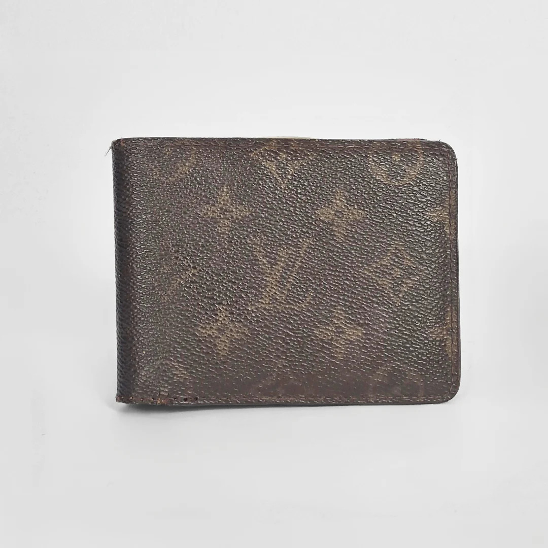 Brown leather wallet on a light gray background